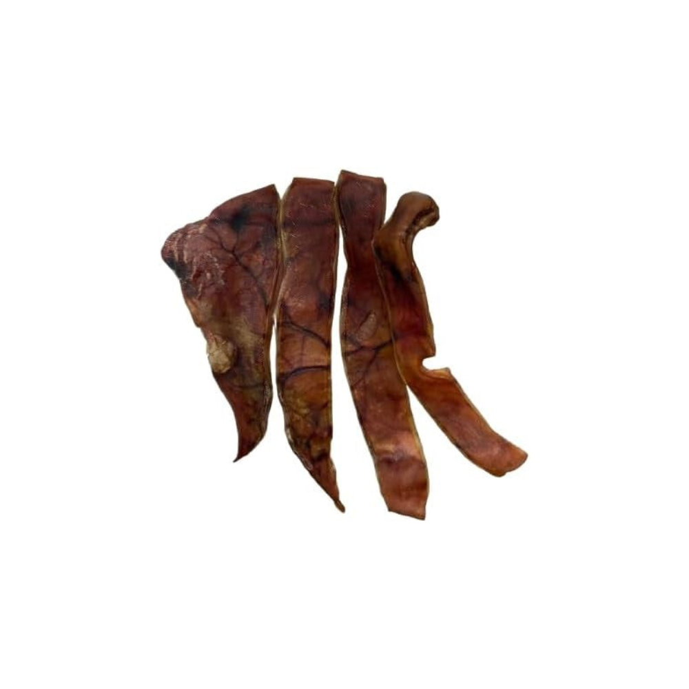 Three dried dog treats on a white background
