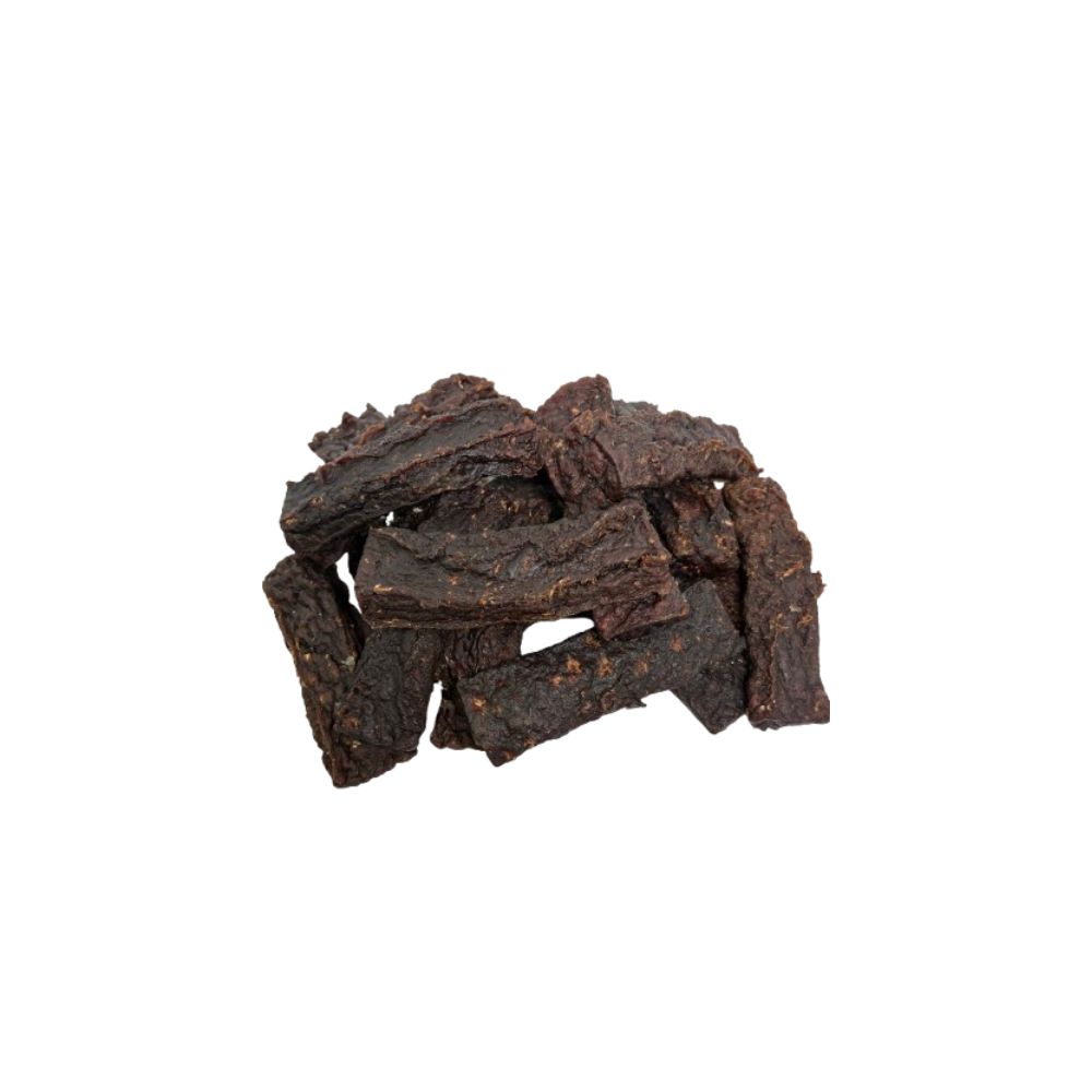 Dried beef jerky pieces on a white background